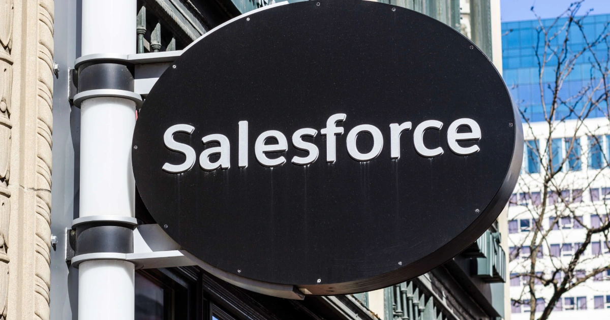 A black oval “Salesforce” sign with white lettering outside a building for Salesforce Implementation in Salt Lake City, UT.